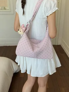 Cute pink polka dot shoulder bag for women, stylish large capacity underarm handbag.