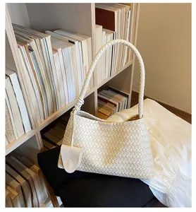 Cream woven underarm bag detailed showcase, elegant style, versatile daily accessory.