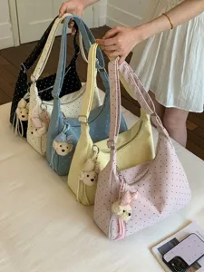 Cute polka dot shoulder bag for women, large capacity underarm bag with sweet plush bear pendant.