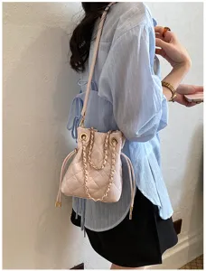 Chic pink quilted chain bucket bag for women, stylish casual daily crossbody bag.