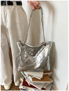 Silver metallic quilted chain tote bag, chic shoulder bag for daily commute and stylish outfits.