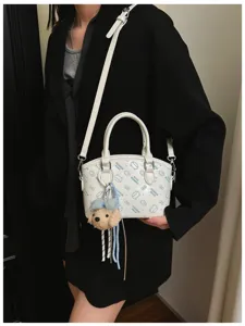 Korean style white shoulder bag with cute cartoon print and plush puppy keychain for women.