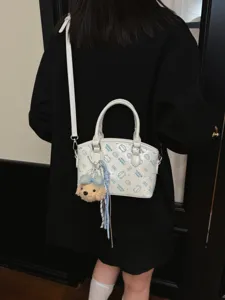 White cartoon print crossbody bag for women, stylish shoulder handbag with cute bear pendant.