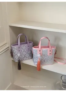 Chinesischer Retro geometrischer Handtasche mit Quaste, vielseitige Schultertasche für Damen.