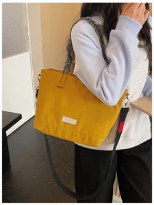 Casual large capacity tote bag for women, stylish shoulder and crossbody bag for daily use.