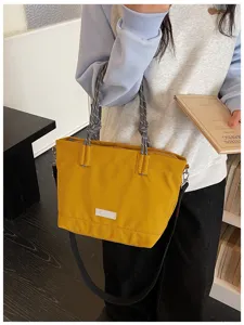 Casual large capacity canvas tote bag, stylish women shoulder handbag for daily commute.