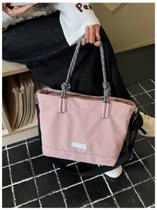 Casual large capacity tote bag for women, stylish shoulder bag with sturdy rope handles.