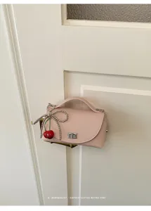 Pink mini shoulder bag with cute cherry and pearl charm, chic retro minimalist design for daily.