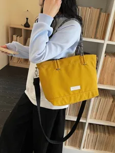 Casual large capacity canvas tote bag with rope handles and crossbody strap for women.