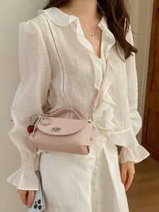 Chic pink leather shoulder bag with top handle and strap, trendy women cross-body handbag.