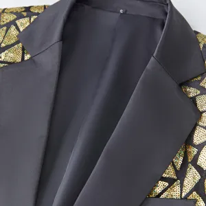 Men's stylish black suit jacket detail featuring gold triangular sequin lapels and collar.