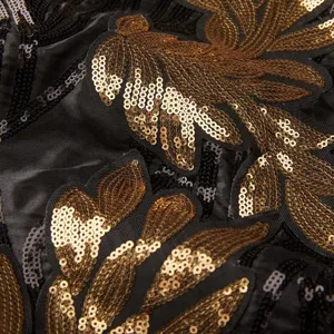 Men's gold sequin blazer detail, luxury art deco embroidered fabric close-up shot