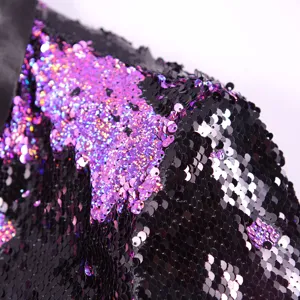 Detail of men's sequin suit jacket fabric, sparkly stage costume close up view