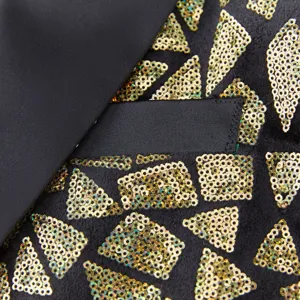 Detailed close-up of a men's sequin blazer showing black fabric with gold geometric sequins.