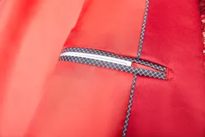Men sequin suit jacket inner pocket detail, premium red fabric with stylish grid trim.