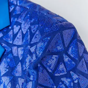 Close-up detail view of men's blue sequin blazer featuring geometric triangular patterns.