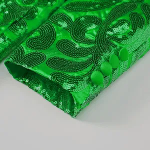 Men green sequin blazer sleeve detail, elegant embroidered fabric cuff with matching buttons.