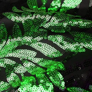 Green sequin fabric detail close-up for stylish men's evening blazer and festive party performance