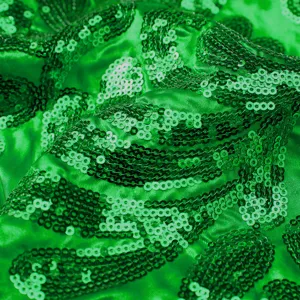 Green sequin men suit fabric close up detail, shining stylish party outerwear textile texture.