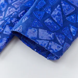 Men blue sequin suit jacket sleeve detail, geometric pattern for party and evening event wear.