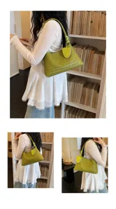 Retro green woven underarm bag for women, stylish shoulder handbag with large capacity casual daily use.