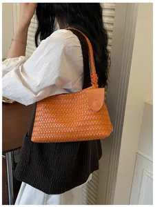 Orange woven leather shoulder bag for women, chic intrecciato underarm hobo bag, stylish daily purse.