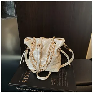 Quilted chain bucket shoulder bag detail, stylish women's PU leather crossbody bag.