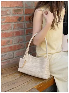 Woven underarm shoulder bag detailed view, minimalist chic retro hobo handbag for women daily wear.