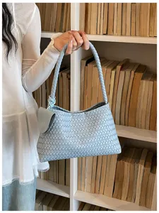 Light blue woven leather underarm shoulder bag, stylish casual daily accessory detail.