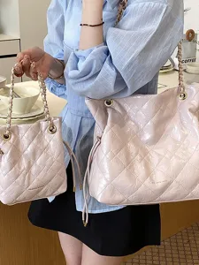 Pink quilted chain tote and bucket bag set for women, stylish faux leather shoulder bag.