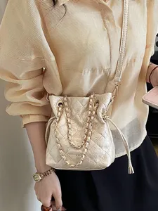 Chic quilted chain shoulder bag for women, elegant bucket crossbody purse for daily wear.