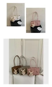 Detailed view of the large capacity tote bag with cute bear pendant, stylish shoulder bag.