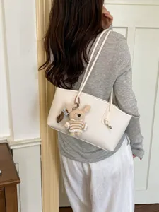 Casual large capacity tote bag for women, chic commuting shoulder bag with cute bunny pendant.