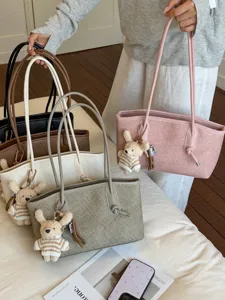 Large capacity tote bag for women, casual commuter shoulder bag with cute bear plush pendant.
