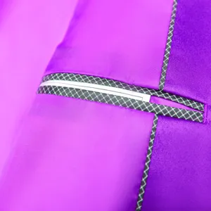 Detailed shot of men's purple satin suit jacket pocket with stylish checkered trim.