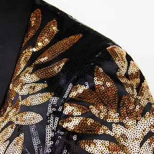 Men's gold sequin blazer detail shot, luxury embroidered jacket fabric close-up view.
