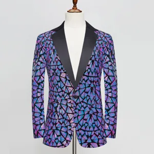Closeup of men's geometric triangle sequin suit jacket detailing, black lapel and button.