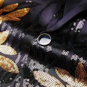 Men sequin blazer fabric detail close up, luxury gold and black sparkle party coat.