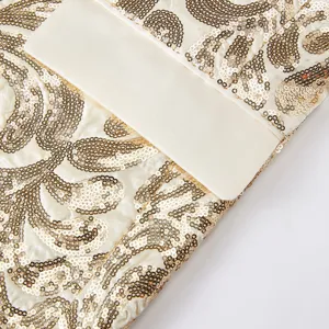 Men's fashion sequin suit jacket fabric detail, luxury gold embroidery on white base.