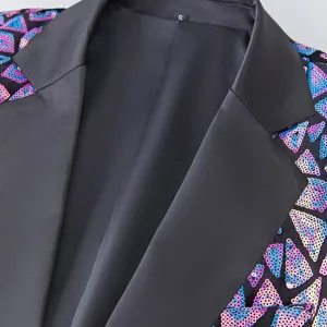 Men's fashion sequin suit jacket detail, geometric triangles and satin lapel for parties.
