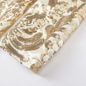 Men's luxury sequin embroidered suit jacket sleeve detail close-up, elegant design cuff.