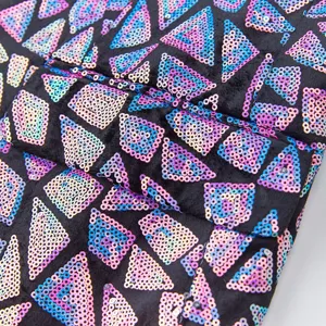 Men's triangle sequin suit jacket detail, sparkly geometric pattern for party performance.