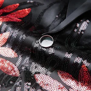 Men's sequin blazer detail, black satin fabric with red and silver patterns for stage.