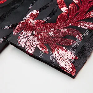 Men sequin blazer sleeve detail, black fabric with red sequin floral embroidery, party costume.