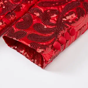 Men's red sequin blazer jacket sleeve detail view showcasing fine embroidery and buttons.