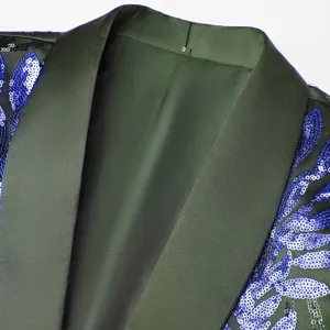 Close-up detail of dark green sequin blazer lapel and collar, stylish performance wear.