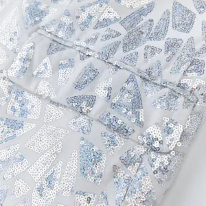 Close up detail of mens silver triangular sequin blazer fabric texture luxury party wear