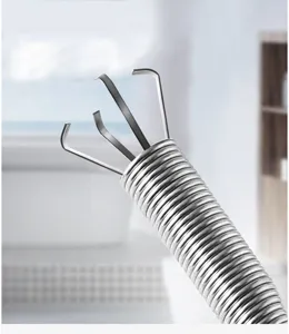 Stainless steel drain clog remover spring tool detail shot for bathroom sink pipe cleaning.