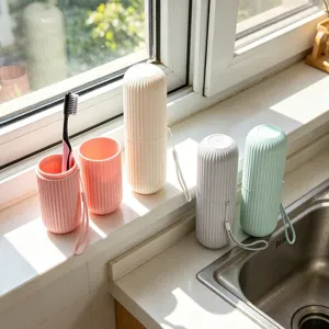 Portable travel toothbrush case set with vertical stripes, plastic mouthwash cup organizer.