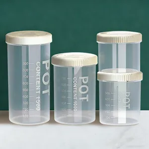 Clear plastic sealed food storage jars set with lids and capacity scale marks for kitchen.